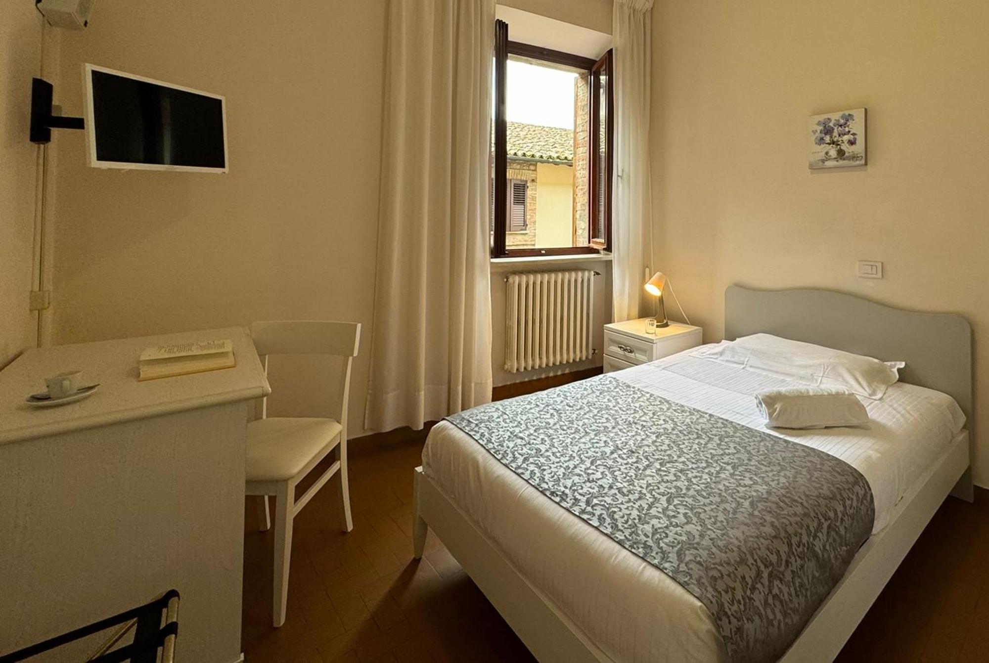 מלון טודי Monastero Ss. Annunziata מראה חיצוני תמונה A room at the hotel